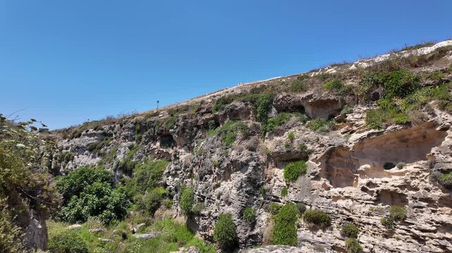 Wied il Mielah, Gharb, Gozo - Valley near limestone natural arch on the north-western coast of the island of Gozo in Malta. High quality 4k footage