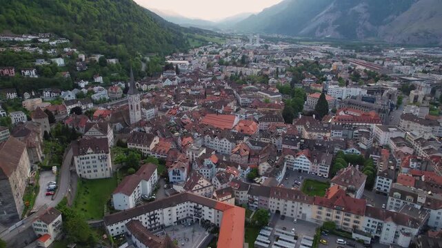 Aerial panoramic view above the old town around the city Chur in Switzerland on a sunny summer afternoon. 