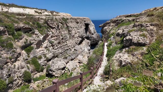 Wied il Mielah, Gharb, Gozo - Way to the Natural arch on the north-western coast of the island of Gozo in Malta, alternative for collapsed Azure window. High quality 4k footage