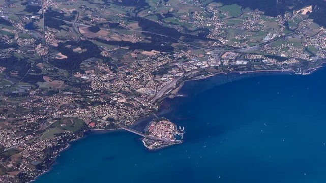 flying along north shoreline of eastern part of Lake Constance (Upper Lake), located in Bavaria, Southern Germany with city of Lindau (Bodensee) Lindau Island, and surrounding landscape - 4k footage