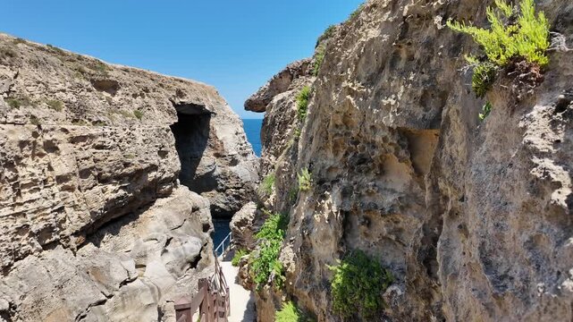 Wied il Mielah, Gharb, Gozo - Way to the Natural arch on the north-western coast of the island of Gozo in Malta, alternative for collapsed Azure window. High quality 4k footage
