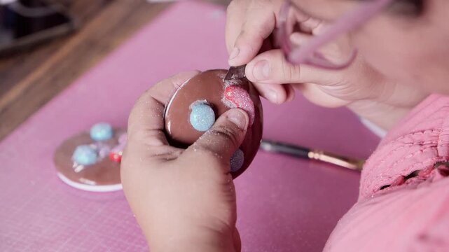 Artisan creating handmade porcelain clay fridge magnets