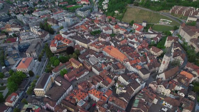 Aerial panoramic view above the old town around the city Chur in Switzerland on a sunny summer afternoon. 