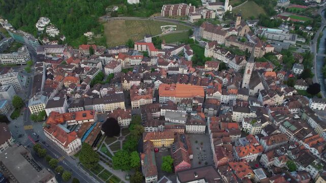 Aerial panoramic view above the old town around the city Chur in Switzerland on a sunny summer afternoon. 