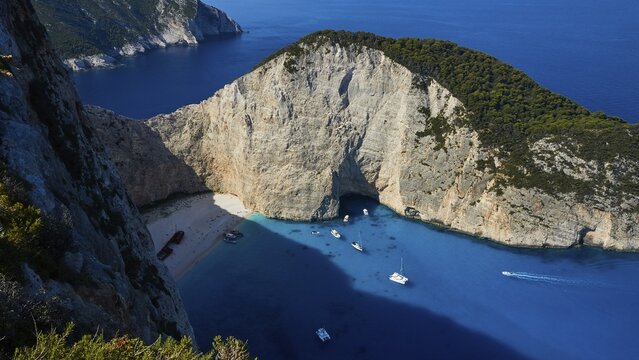Paralia Navagio, rocky cliff, Shipwreck Beach, shipwreck MV Panagiotis, excursion boats, blue and turquoise crystal clear sea, Zakynthos, Ionian Islands, Greece