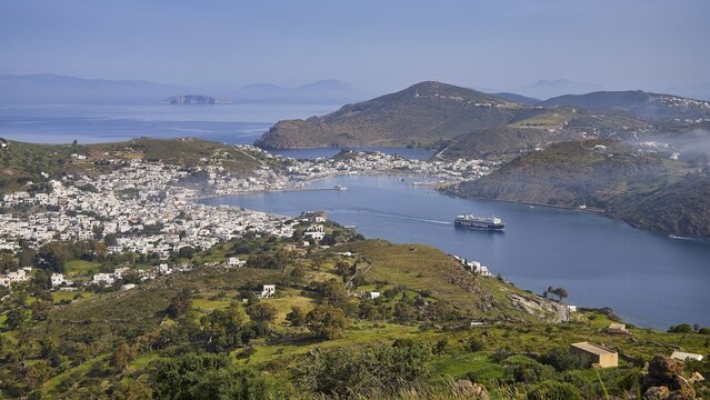 Panoramic view of a bay with town, ferry and surrounding landscape, Skala, harbour, Patmos, Dodecanese, Greek Islands, Greece