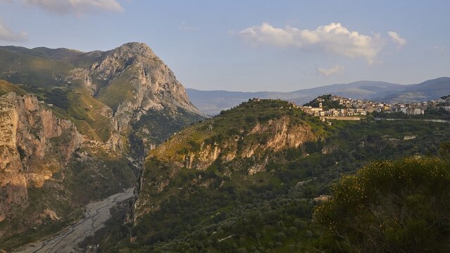 Evening light, gorge, mountain, village on hill, Militello Rosmarino, village, Nebrodi National Park, Sicily, Italy