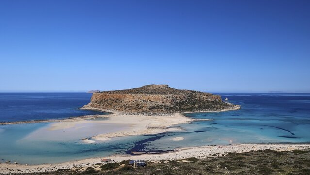 Large island surrounded by a clear blue sea under an unclouded sky, natural beauty, Gramvoussa, Gramvoussa peninsula, pirate bay, Balos, lagoon, north-west Crete, Crete, Greek islands, Greece