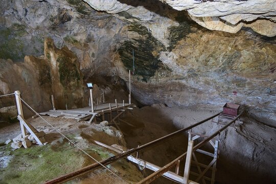 View of a barren cave environment with wooden walkways and natural rock structures, museum, Charkadio Cave, Dwarf Elephant (Palaeolodoxon tiliensis), Elephas Tiliensis, Megalo Chorio, Zero Waste Island, Tilos, Dodecanese, Greek Islands, Greece