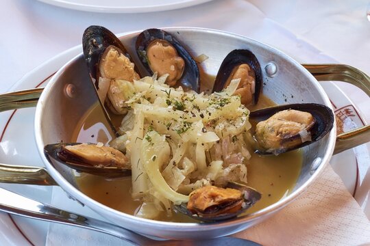 Tasty seafood platter with mussels and aromatic herbs in an elegant restaurant, Hotel Europa, garden restaurant and views of the surrounding countryside, Olympia, Peloponnese, Greece