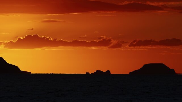 Tranquil island landscape at sunset, soft orange tones in the sky over the sea, sunset, Kassos, Karpathos, offshore islands, Dodecanese, Greek Islands, Greece