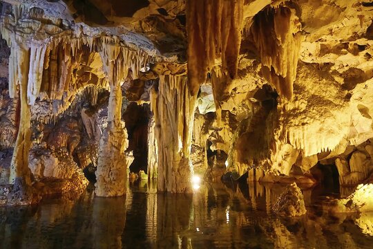 Cave with illuminated stalactites and stalagmites, reflection in the water, stalactite cave, Diros Cave, Glyafada Cave, Vlychada Cave, Mani, Peloponnese, Greece