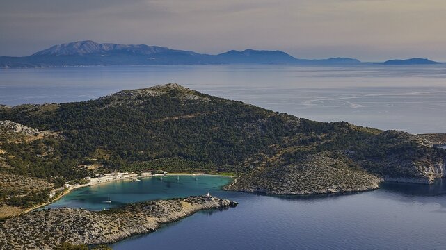 Coastal landscape with hills and blue water under a clear sky, Holy Week, Panormitis Bay, Panormitis Monastery, Symi, Dodecanese, Greek Islands, Greece