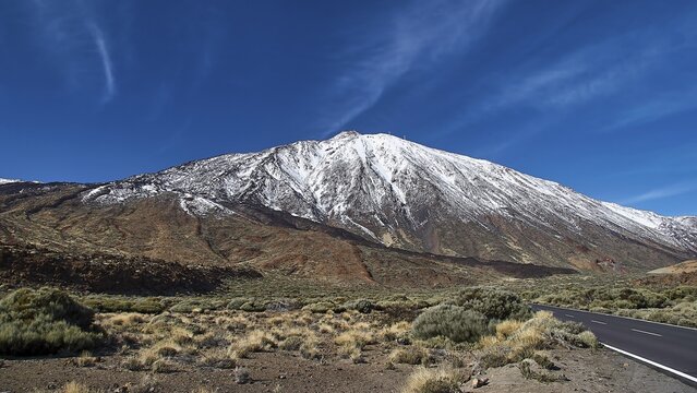 Clear blue sky over a road leading along an imposing mountain range, Teide, Parque Nacional del Teide, Teide National Park, volcano, volcanism, UNESCO World Heritage Site, Tenerife, Canary Islands, Spain