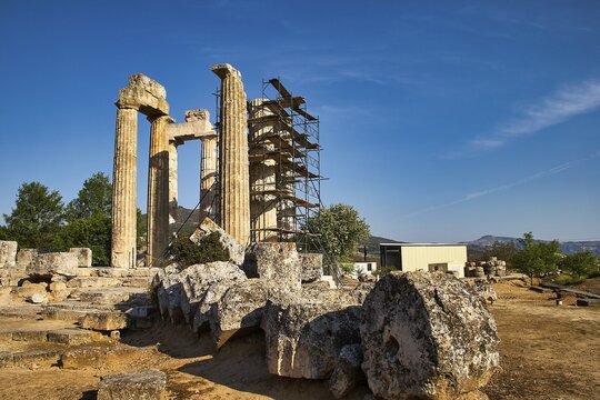 Ancient columns with landscape in the background. Ruins and Nature, Nemea, Ancient Temple of Zeus, Archaeological Site, Peloponnese, Greece