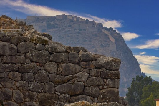 Sky changed, Argos Castle, Larissa Castle, View from Tiryns of an old stone castle in the mountains under a clear blue sky, Tiryns, Ancient City in Argolis, Mycenaean, Peloponnese, Greece