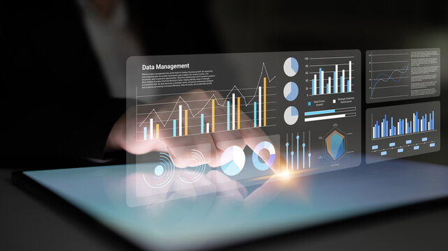 A modern workspace showcases an innovative touchscreen interface for data management, featuring detailed graphs and charts that enhance analytical capabilities and decision-making. Gantry
