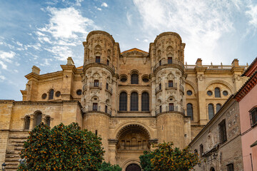 Fototapeta premium View at the Malaga Cathedral or Santa Iglesia Catedral Basílica de la Encarnación, an iconic national landmark ,16th-century baroque facade