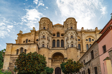Fototapeta premium View at the Malaga Cathedral or Santa Iglesia Catedral Basílica de la Encarnación, an iconic national landmark ,16th-century baroque facade