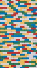 Obraz premium Vibrant top down flat lay of interlocking colorful lego bricks in primary colors with smooth texture