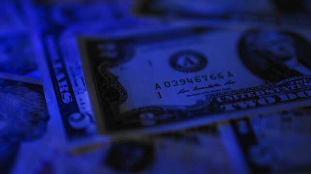 Police seized illegal money, smuggling. A close-up of the shadow market and dirty dollar bills used by criminals and scammers for laundering.