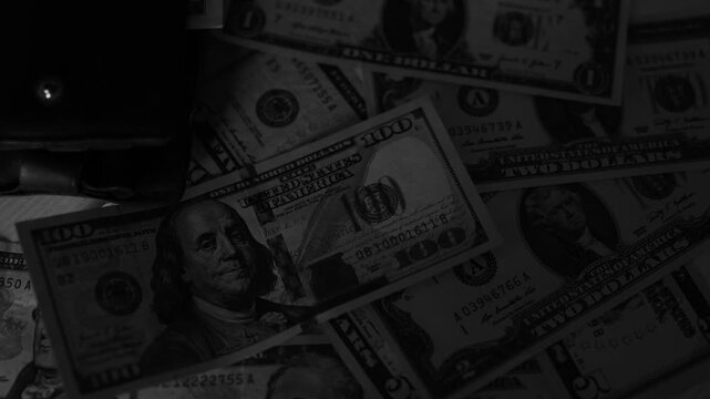Police seized illegal money, smuggling. A close-up of the shadow market and dirty dollar bills used by criminals and scammers for laundering.