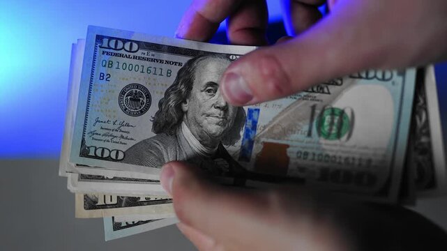 Police seized illegal money, smuggling. A close-up of the shadow market and dirty dollar bills used by criminals and scammers for laundering.