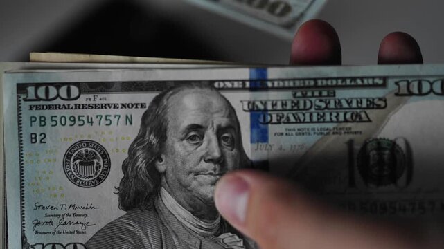 Police seized illegal money, smuggling. A close-up of the shadow market and dirty dollar bills used by criminals and scammers for laundering.