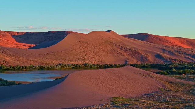 Golden sunset aerial view of Bruneau Dunes State Park