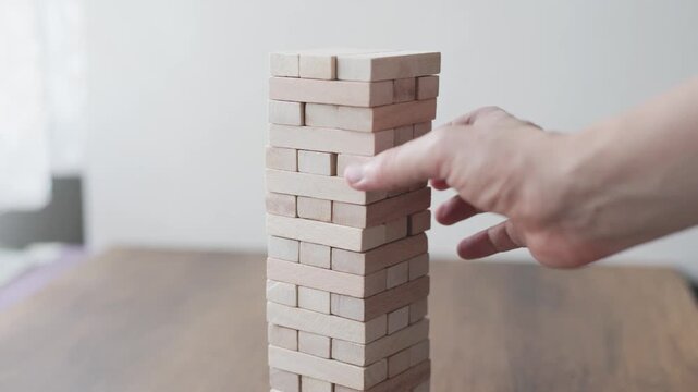 Close-up of wooden tumbling tower balance game