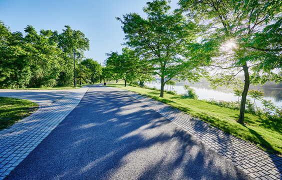 The paved pedestrian path running through Corning Preserve (aka Jennings Landing) along the Hudson River waterfront in Albany, New York