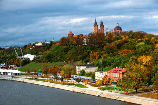 Scenic autumn landscape of Plock Tumskie Hill with historical cathedral, castle and Vistula river embankment. Plock, Poland