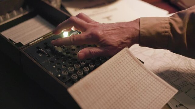 WWII German soldier using an enigma machine