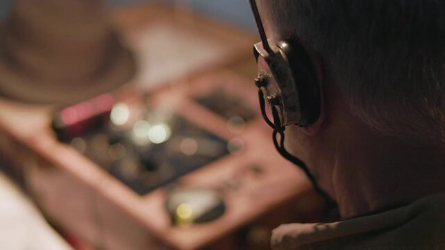 WWII spy sending messages focus on headphones