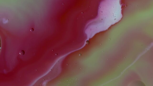 Abstract Fluid Art Macro - Swirling Lime Green and Crimson Paint Waves with Oil Bubbles