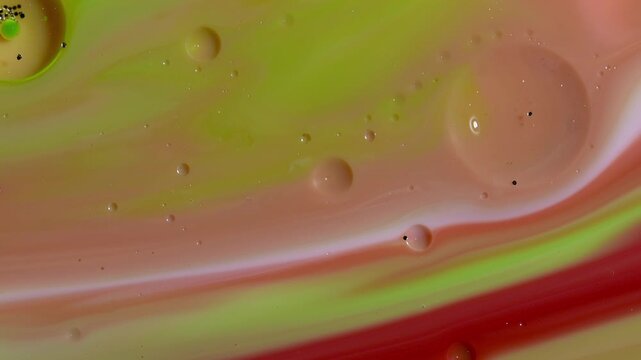 Abstract Fluid Art Macro - Swirling Lime Green and Crimson Paint Layers with Oil Bubbles