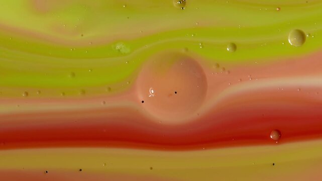 Abstract Fluid Art Macro - Layered Lime Green and Crimson Paint with Floating Oil Bubbles
