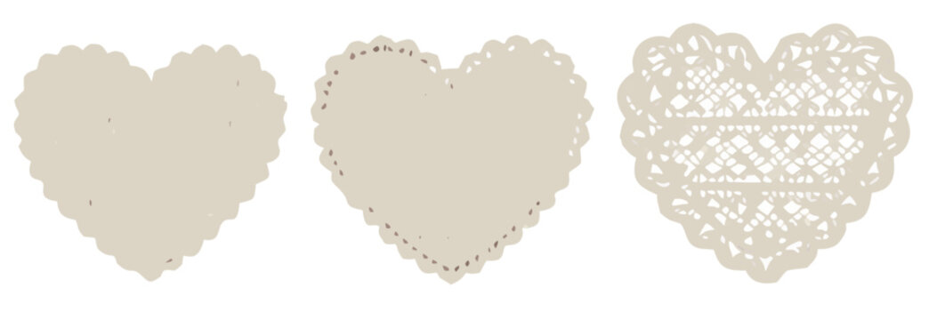 Three heart shaped paper doilies progression from plain to intricately patterned