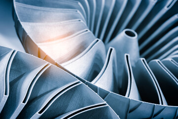 Close-up of 3D-printed metal turbine. machined surface reveals precise details. innovative additive...