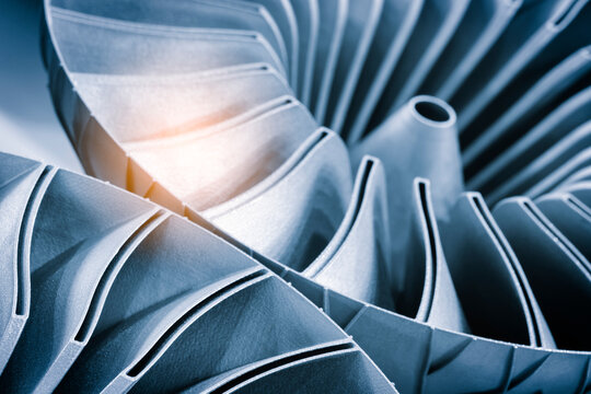 Close-up of 3D-printed metal turbine. machined surface reveals precise details. innovative additive technologies concept background