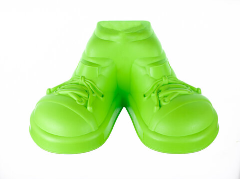 Plastic green children's shoes isolated on white background