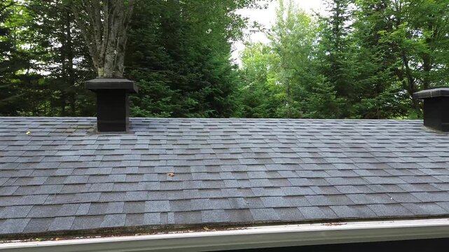 Inspecting a house shingles roof with a drone