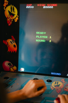 Louisville, KY/USA - April 24, 2026: Anonymous kid playing Pac-Man arcade game