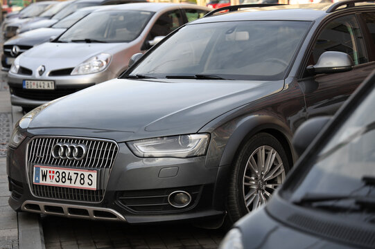 WIEN, AUSTRIA - January 29, 2025: Cars parked in the parking lot Cars parked on the urban street side Perspective long view Audi quattro Renault Mercedes Benz