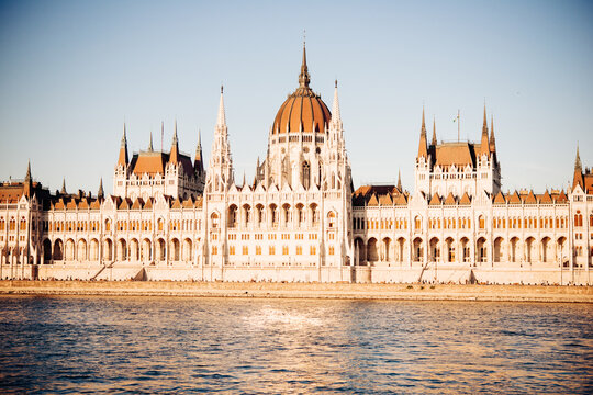 View of the Parliament building seen from the Danube river in the evening in Budapest, Hungary.