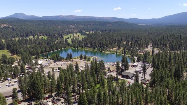 Graeagle California - Aerial Circle Around Mill Pond and Downtown on Busy July Summer Weekend Facing South