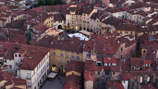 Aerial view of the main square, Piazza dell'Anfiteatro, in Lucca, Tuscany, Italy. Medieval Historical Center at Twilight