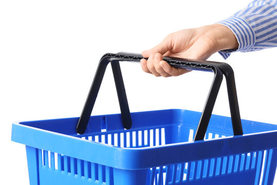 Female hand with blue shopping basket on white background