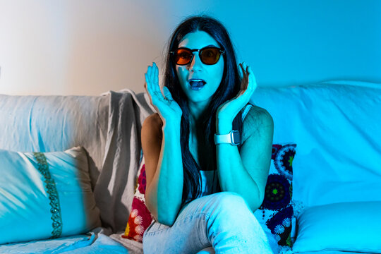 Young woman wearing blue light blocking glasses for digital eye strain protection
