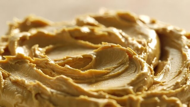 Close up swirl texture of creamy peanut butter.